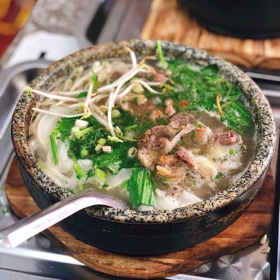 Enjoying a bowl of hot pho on a rainy day is a memorable culinary experience